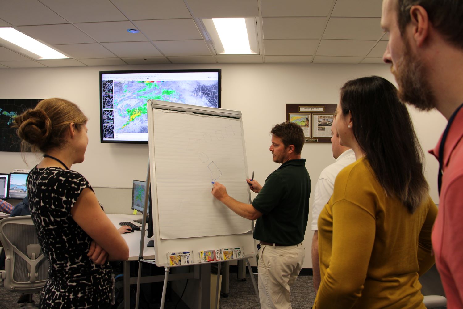 Collaborators discussing science at the Aviation Weather Testbed